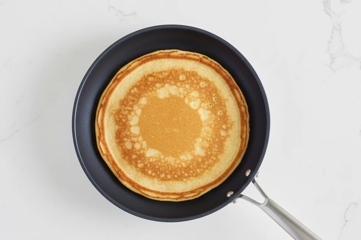 Overhead pancake showing even browning across the pan surface
